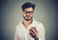 Young man upset about phone