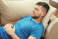 Young man with stomach pain