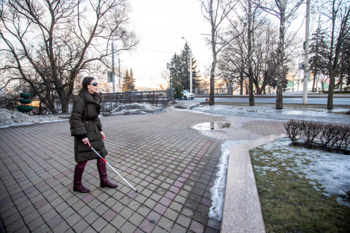 blind woman walking in New York City