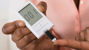 A diabetes patient checks her blood sugar.