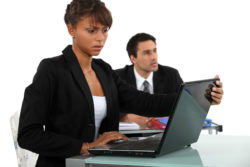 Concerned woman looking at laptop