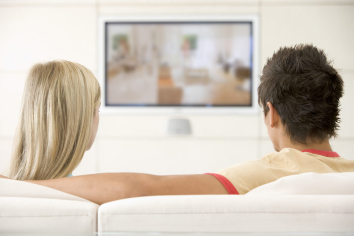 couple watching samsung plasma tv