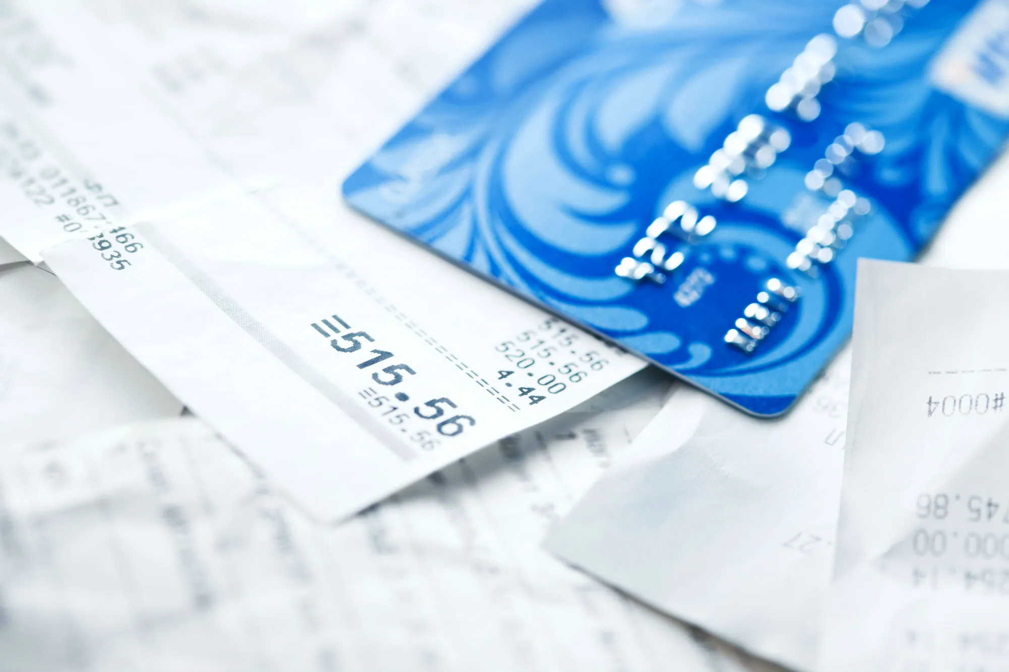 Credit card on pile of receipts