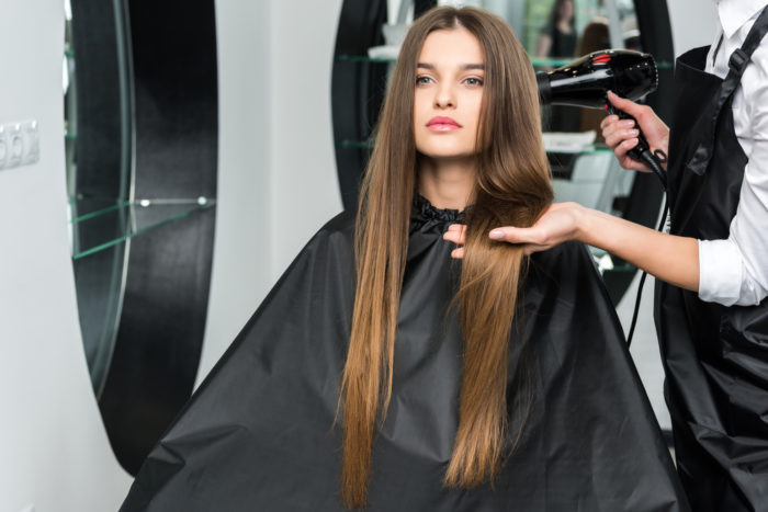 drybar hairdresser drying hair