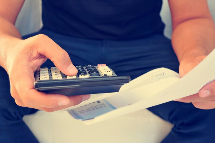man holding pay stub