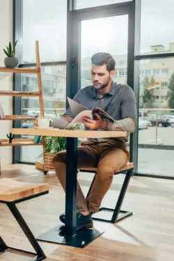 man reading Smithsonian magazine