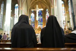 Nuns praying in church