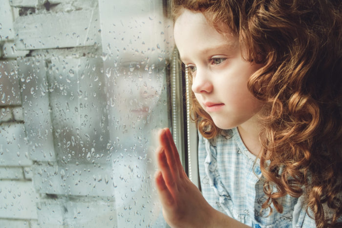 Indiana foster kid looking out the window