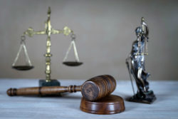 Scales, gavel, and a statue of justice