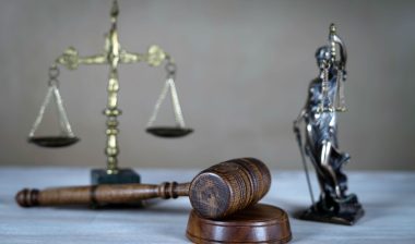Scales, gavel, and a statue of justice
