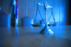 Scales of justice pertaining to a medical malpractice lawsuit.