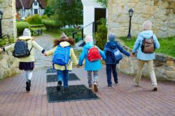 Schoolchildren walking with backpacks