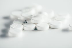 White pills on white