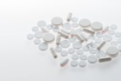 white pills on white background
