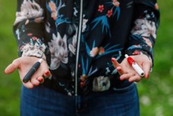 woman holding ecigarettes