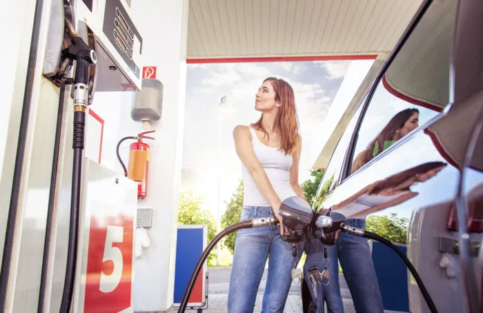 los angeles woman pumping gas