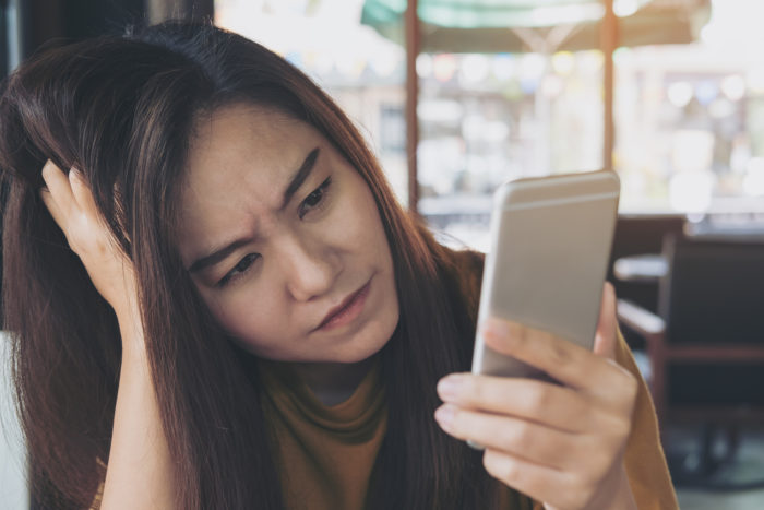 woman getting an unwanted call from National Holdings Corporation