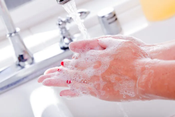 woman washing hands with Dial soap