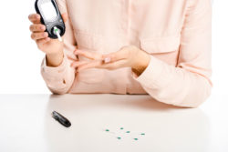 Diabetic patient making sure glucose levels are normal.