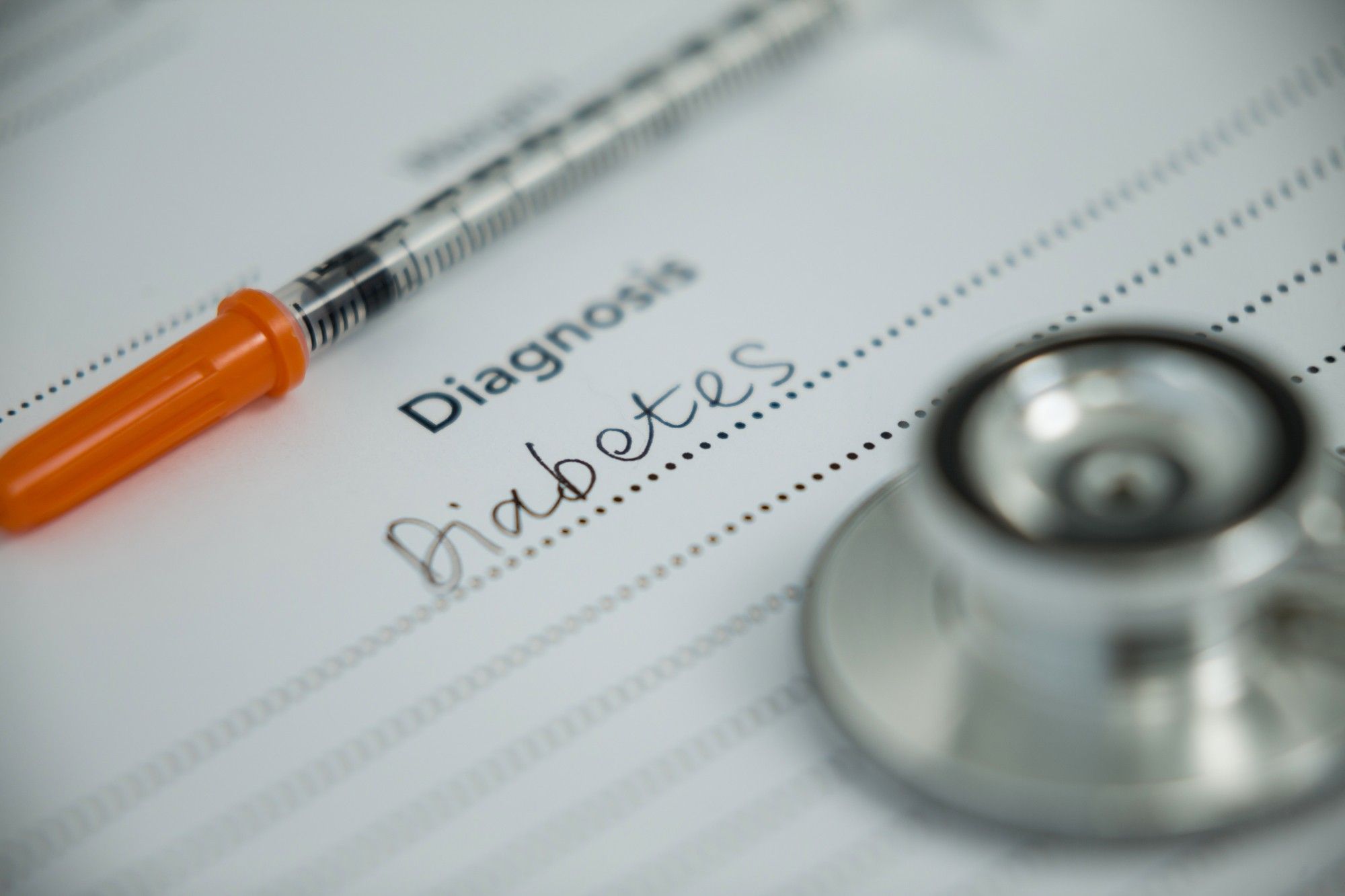 Injection with diabetes diagnosis and stethoscope