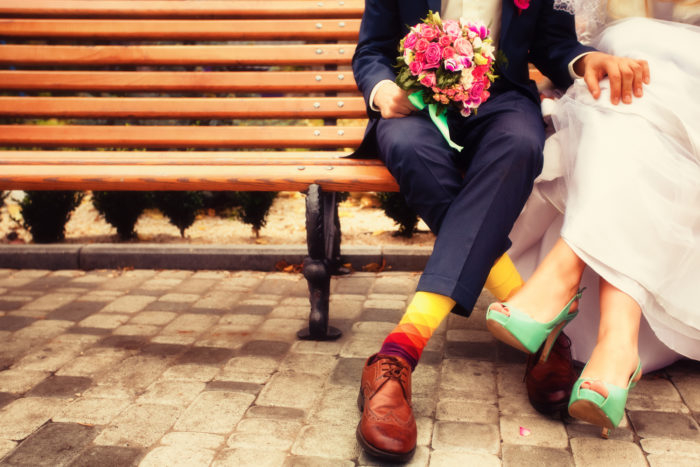 bride and groom holding a bouquet made by Eco Flower