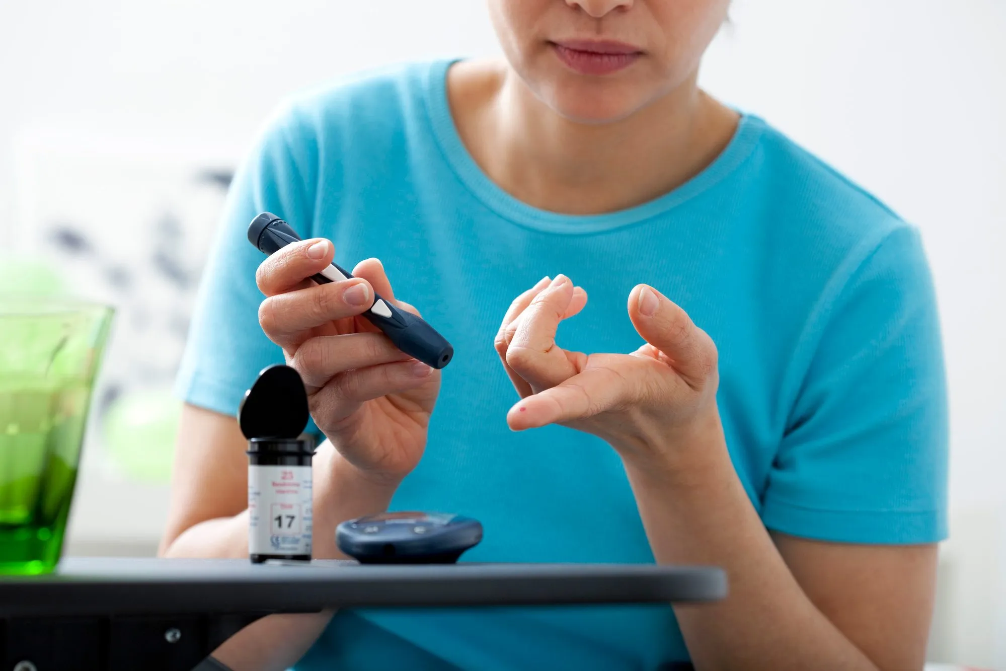 Woman taking diabetes test