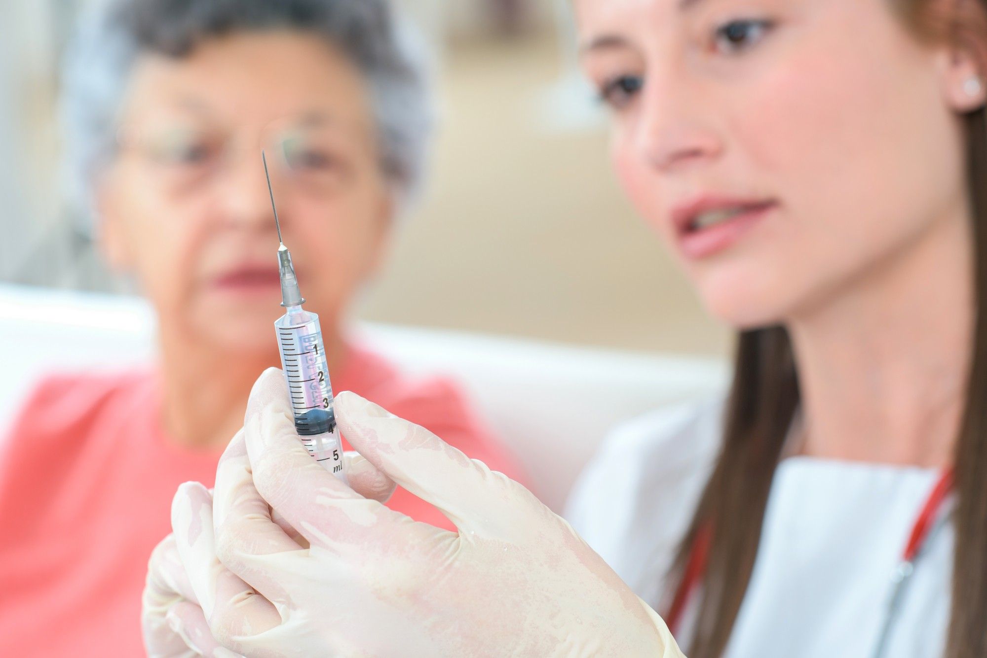 Elderly woman getting injection