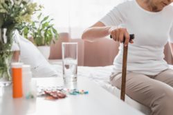 Elderly woman with cane
