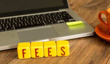 Fees written on wooden blocks