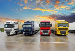 Four semi trucks on parking lot