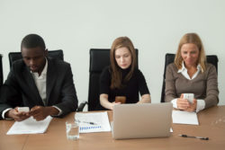 Group of workers using cell phones