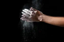 Rubbing talcum powder into hands