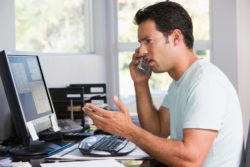 Angry phone call in home office