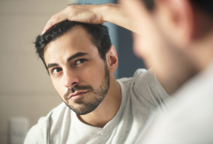 man using just for men hair dye