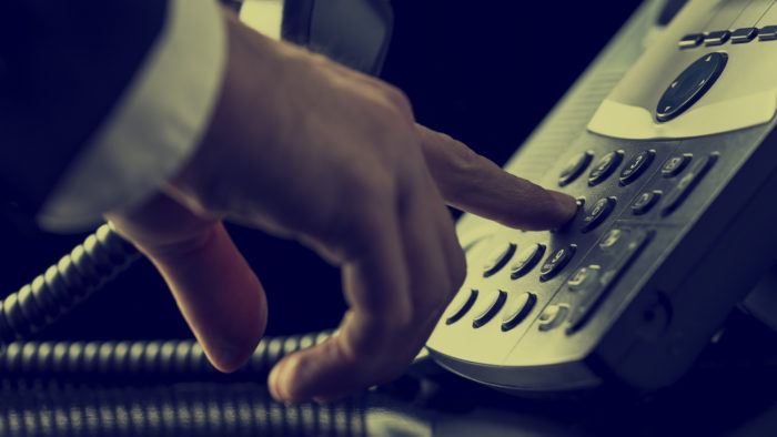 man placing call to parcel pending