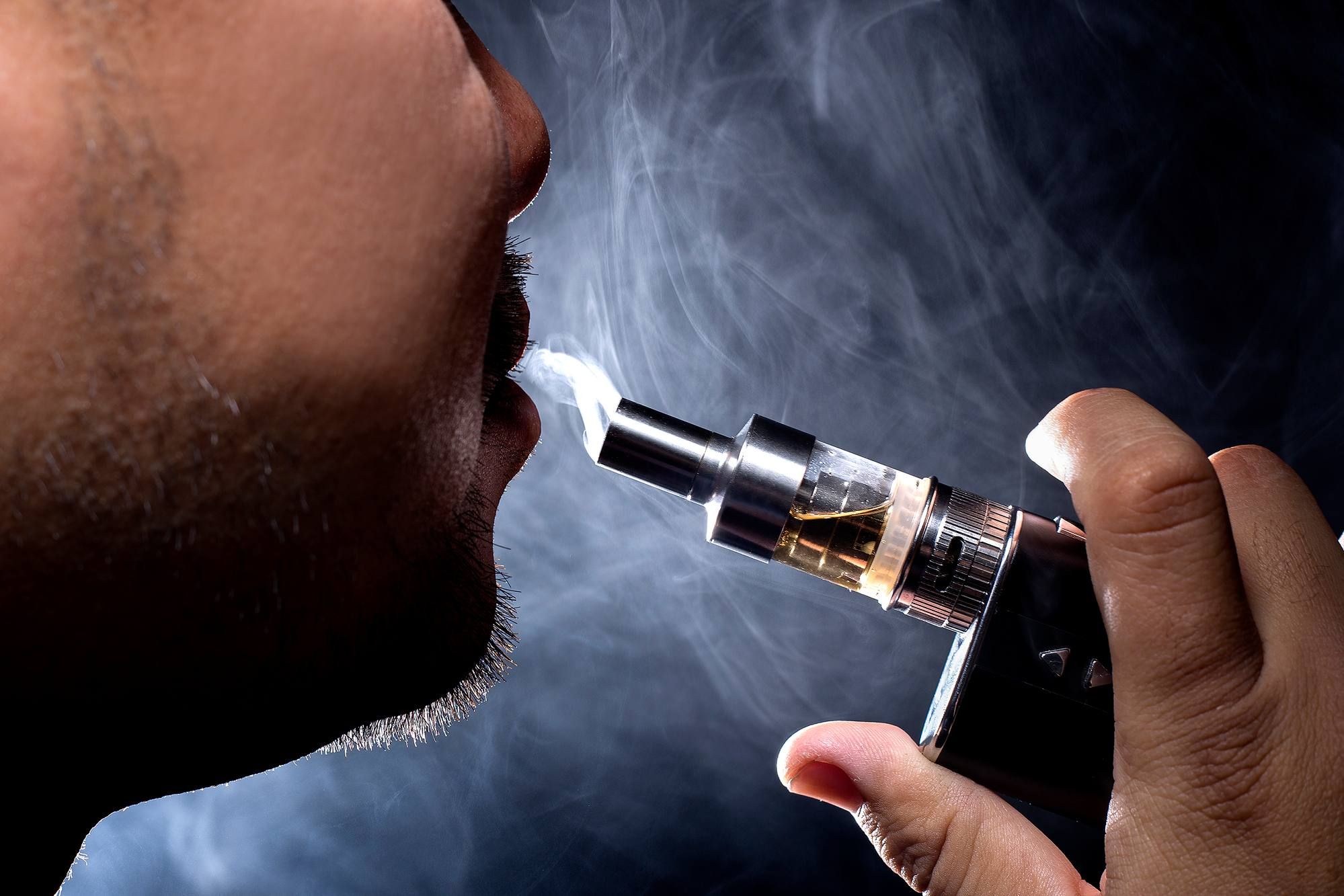 man smoking ecigarette
