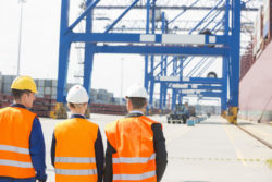 Workers walking in shipyard