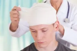 person with doctor after brain injury