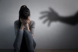 Depressed woman sitting on the floor