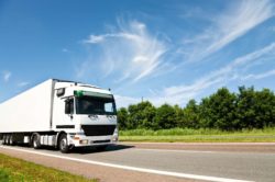 Truck driving on country road