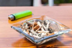 Ash tray with lighter