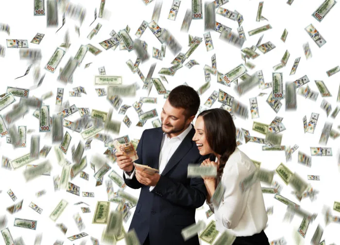 couple counting settlement check money