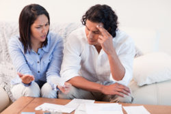 A couple talks over their bank statements.