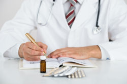 Doctor writing prescription to recover from Stevens Johnson syndrome