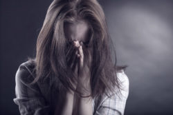 A woman who was a victim in a sexual assault scandal at an elite girl's school in 1997 faces legal action over alleged lobbying activities.