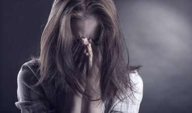 A woman who was a victim in a sexual assault scandal at an elite girl's school in 1997 faces legal action over alleged lobbying activities.