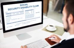 man filling out claim for social security disability