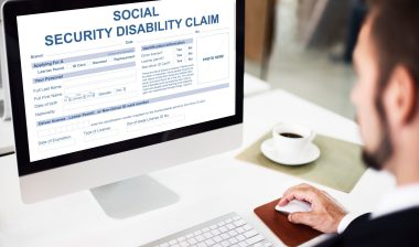 man filling out claim for social security disability