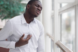 Man suffering from heartburn