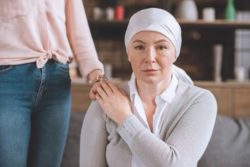 sick mature mother in kerchief